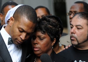 Wanda Johnson, the mother of Oscar J. Grant III, is comforted by supporters. Mark Ralston/AFP/Getty Images)