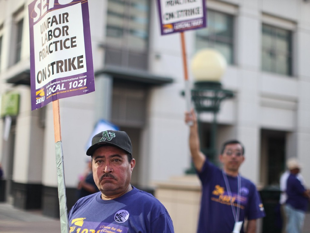 City of Oakland workers and BART employees form in groups around Frank Ogawa Plaza during the strike earlier this month. Photo by Deborah Svoboda/KQED