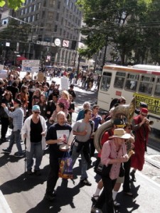 More than 1,000 people marched on Market St. to the Federal Department of Education's SF offices to demand that they save City College of San Francisco from losing its accreditation. (Rachael Marcus/KQED)