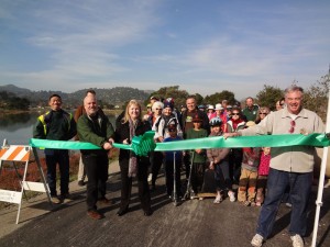 The Ross Valley Sanitary District in happier times, celebrating the opening of the Corte Madera path and completion of the replacement of a large main pipe. At the front, cutting the ribbon, can be seen former sanitary district manager Brett Richards and former board member Marcia Johnson. Photo: RVSD Courtesy press photo