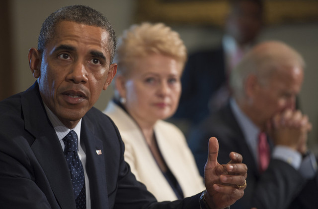 Pres. Barack Obama delivers a statement on Syria during a meeting with Lithuania's Pres. Dalia Grybauskaite (center) and Vice Pres. Joe Biden at the White House in Washington, DC on August 30, 2013. (Jim Watson/AFP/Getty Images)