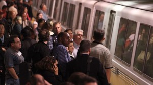 Commuters wait to board a Bay Area Rapid Transit (BART) train during rush hour on October 29, 2009 in San Francisco.  (Photo by Justin Sullivan/Getty Images) 