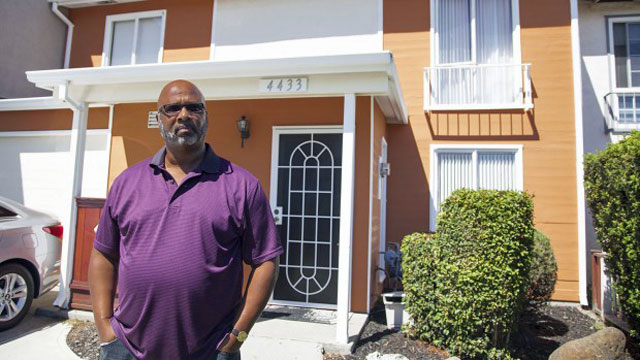 Richmond resident Morris LeGrande, a supporter of the city's eminent domain scheme, stands in front of his home (Mark Andrew Boyer?Richmond Confidential)
