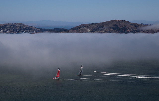 Emirates Team New Zealand (red wing) duels Oracle Team USA in America's Cup action on San Francisco Bay on Sunday. (Justin Sullivan/Getty Images)