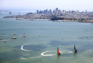 Emirates Team Zew Zealand and Oracle Team USA in pre-race maneuvers on Tuesday.  (Jamie Squire/Getty Images)