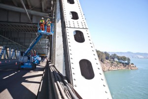 While the new eastern span of the bay bridge is being put into place, the western span was covered with maintenance workers over the weekend. (Deborah Svoboda/KQED)