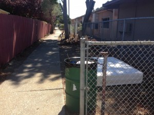 A mattress is dumped in an alley beside Stege Elementary School. (Richmond Confidential)