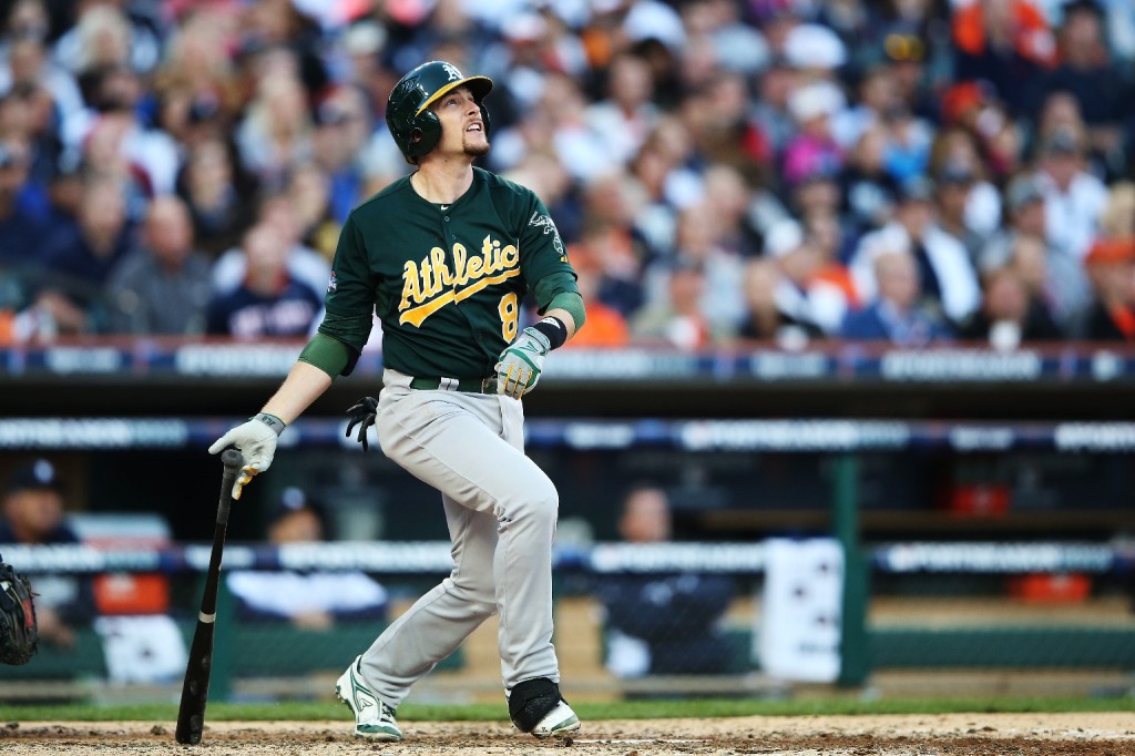 A's shortstop Jed Lowrie follows the flight of the ball as he homers in the fifth inning of Tuesday's game. (Leon Halip/Getty Images)