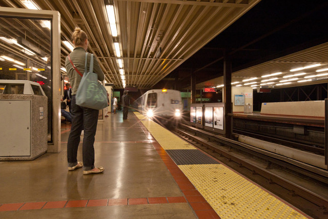 A BART train pulls in the MacArthur station in Oakland. (Deborah Svoboda/KQED)
