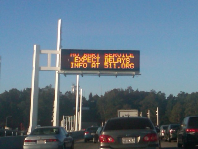 On Friday, Oct. 18, a sign on the Bay Bridge warns commuters to expect traffic because of no BART service. (Ellen Barkenbush/KQED)