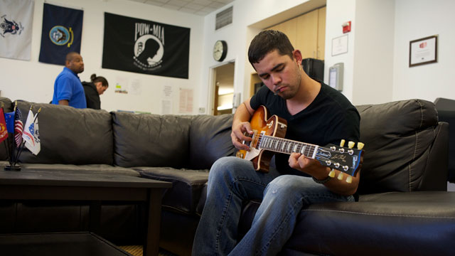 Edwin del Rio waited two years for the  Department of Veterans Affairs to resolve his disability claim. When he received a $31,000 retroactive benefits check, he used some of it to  buy a new electric guitar and pay off debt. (Monica Lam/KQED)