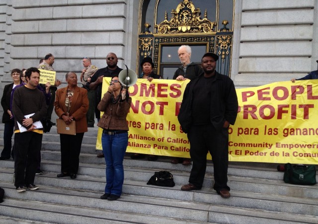 Tenants facing evictions hold a rally outside San Francisco City Hall Thursday (Bryan Goebel/KQED)