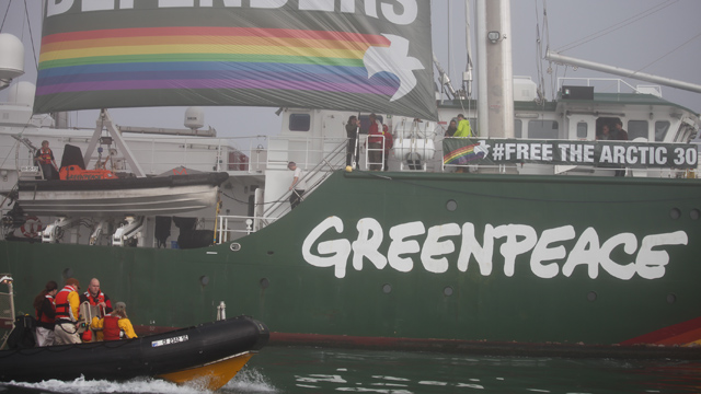 A banner hanging from the side of the iconic ship calls attention to 30 Greenpeace activists currently imprisoned in Russia. (Deborah Svoboda/KQED)