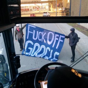 The view from a shuttle bus in West Oakland, headed for Google's Mountain View campus but halted by protesters. (@craigsfrost via Twitter).
