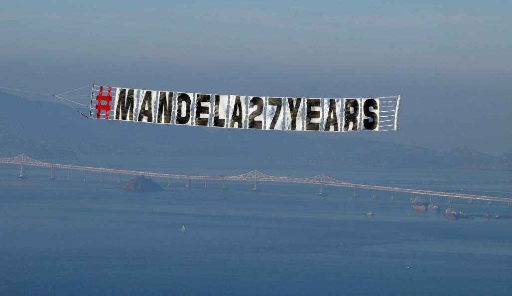 Pilots from the Tuskegee Airmen Inc. nonprofit flew over the Bay Area Saturday in a tribute to Nelson Mandela. (Tawanda Kanhema)