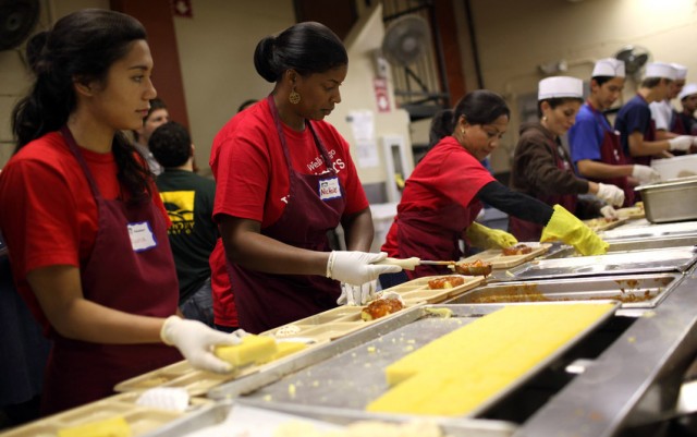 Volunteers prepare meals for the needy at the St. Anthony foundation dining room in San Francisco. (Justin Sullivan/Getty Images)