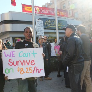 A protester at a fast-food wage protest in Oakland in early December. They are asking for $15 and the right to form a union. (Sara Hossaini/KQED)