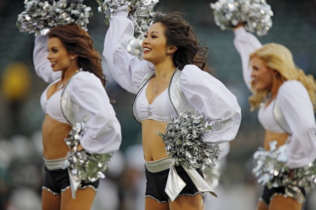 Members of the Oakland Raiderettes during a November 2013 game at the Coliseum. (Brian Bahr/Getty Images)