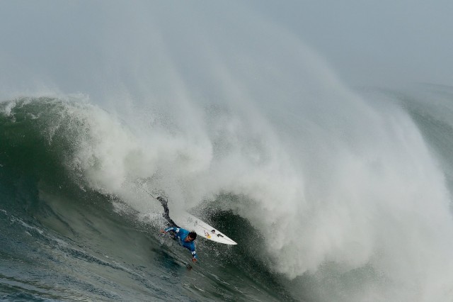 Carlos Burle takes a header  during an early heat in today's Mavericks Invitational in Half Moon Bay. (Ezra Shaw/Getty Images)