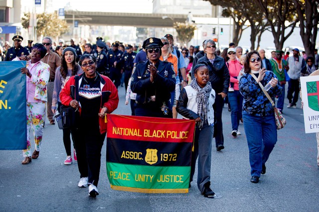 Members of the National Black Police Association sang gospel hymns as they marched down 3rd Street in San Francisco during the annual Martin Luther King Jr. Day march.