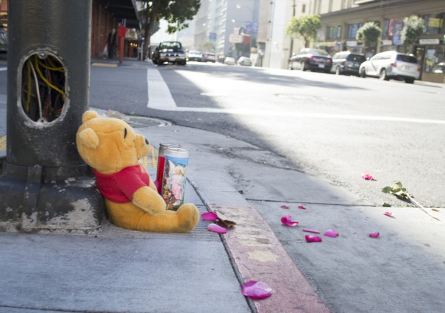 A memorial at the intersection of Polk and Ellis streets in San Francisco, where a 6-year-old girl was struck by a car and killed on New Year’s Eve. (Sara Bloomberg/KQED)