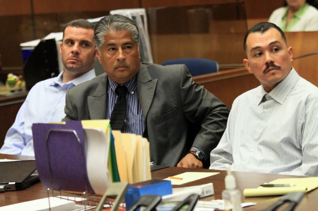 Marvin Norwood, left, and Louie Sanchez, right, with attorney Victor Escobedo during 2012 preliminary hearing on charges they attacked Giants fan Bryan Stow at Dodger Stadium. (Getty Images)