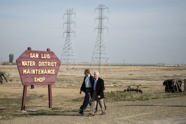 President Obama and San Joaquin Valley Congressman Jim Costa walk to a meeting with local residents in the Fresno County town of Firebaugh. (Brendan Smialowski/AFP/Getty Images)