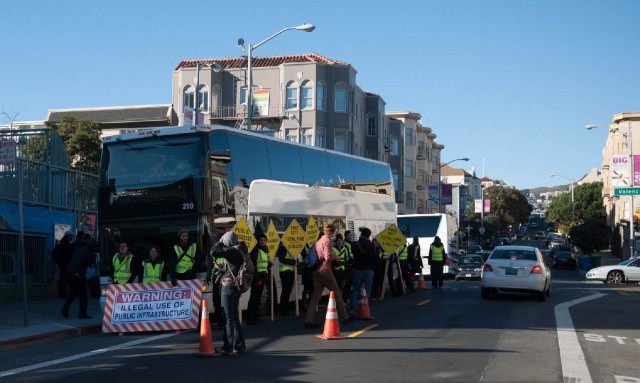 Activists surround a Google bus in a December 2013 protest at 24th and Valencia streets. (cjmartin/Flickr)