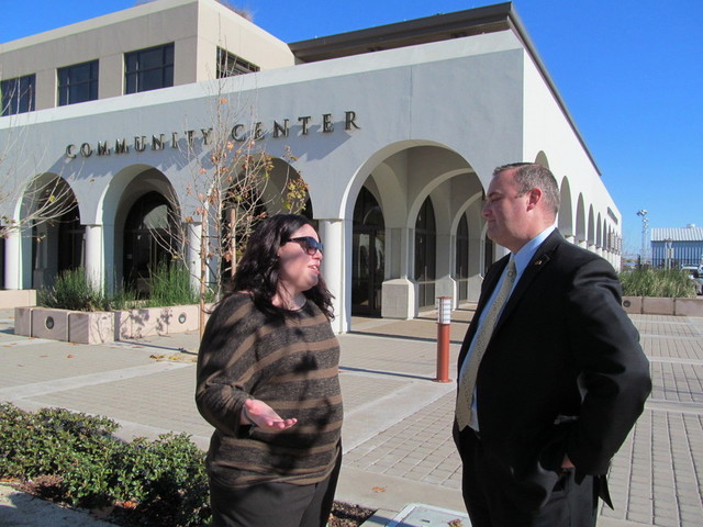 Attorney Leah Castella and Brentwood City Manager Paul Eldredge chat in front of Brentwood's Community Center. (Cyrus Musiker/KQED)
