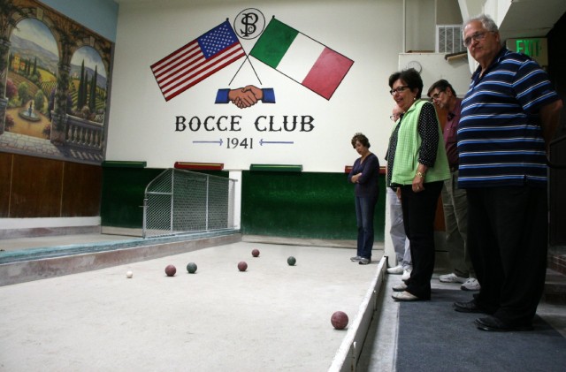 Joseph Lencioni (right) and other members of San Mateo's Peninsula Italian American Social Club during weekly bocce league play. (Vanessa Rancaño/KQED)