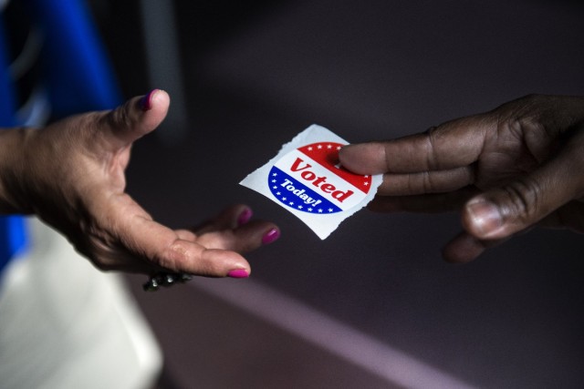 More and more Californians are voting by mail, but the trend is more pronounced for Asian voters and those over 55. (Brendan Smialowski/Getty Images)