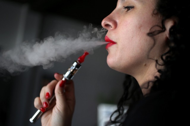 Julia Boyle enjoys an electronic cigarette at the Vapor Shark store. (Joe Raedle/Getty Images))