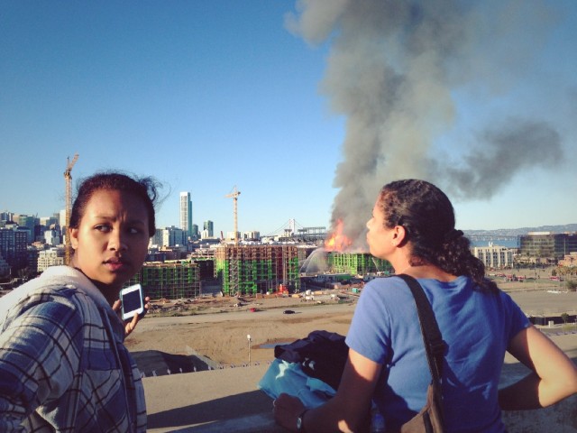 People watch the China Basin fire from afar. (Jeremy Raff/KQED)