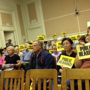 Neighbors and merchants — including Mokka owners Susan and Michael Iida, front row, right —  turned out to a zoning board meeting on Nov. 19, 2013 to request a public hearing over the proposed Starbucks at Ashby and Telegraph avenues in Berkeley. (Emilie Raguso/Berkeleyside)