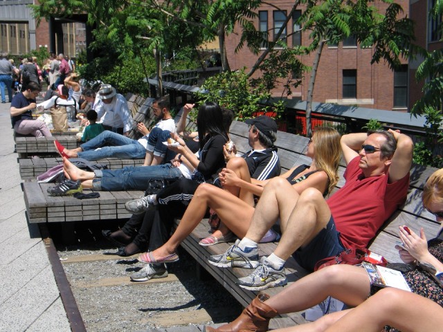 These people relaxing along the High Line in New York in May 2012 are in no rush to get anywhere. (Patricia Yollin/KQED)