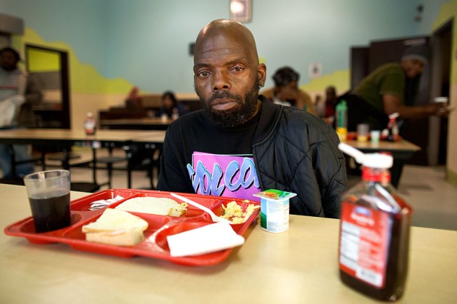 Calvin Henderson is one of many homeless people who sleep in the chairs at Mother Brown's (Mark Andrew Boyer / KQED)