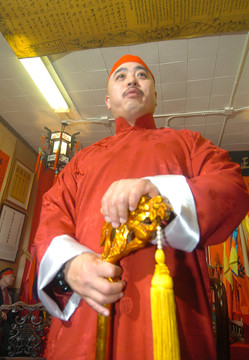 In this photo taken Aug. 6, 2006, Raymond "Shrimp Boy" Chow is shown after being sworn in as the "Dragon Head" of the Ghee Kung Tong in Chinatown in San Francisco. Investigators say Chow is the leader and the dragonhead of one of the most powerful Asian gangs in North America. Chow's gang is said to have lured state Sen. Leland Yee into its clutches through money and campaign contributions in exchange for legislative help, as Yee sought to build his campaign coffers to run for California secretary of state. Born in Hong Kong in 1960, Chow came to the United States at 16 and was reportedly nicknamed "Shrimp Boy" by his grandmother, in part due to his small stature. (AP Photo/Sing Tao Daily)