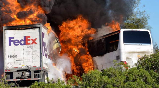 FedEx truck and bus burn on Interstate 5 after Thursday collision. (Jeremy Lockett via KRCR-Redding and Twitter).