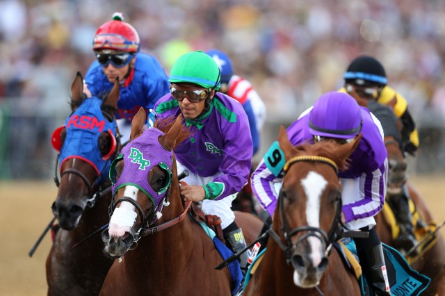 California Chrome, center, heads toward victory in the Preakness States at Baltimore's Pimlico Race Course. Disputed nasal strip is visible just above Chrome's nostrils. (Matthew Stockman/Getty Images)