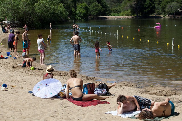 Beachgoers wade into the water at Lake Anza in the East Bay's Tilden Regional Park. (Mark Andrew Boyer/KQED)