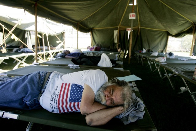 A homeless veteran sleeps in a tent in San Diego in 2007. (Sandy Huffaker/Getty Images)