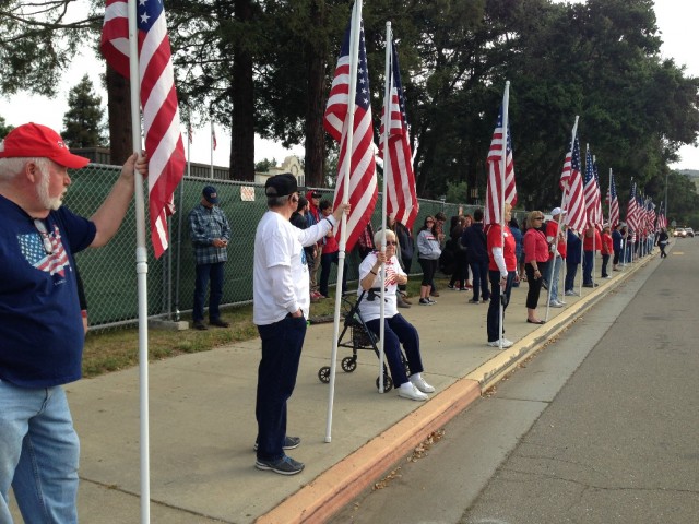 Protesters outside Live Oak High School in Morgan Hill on Monday morning. (Francesca Segre/KQED)