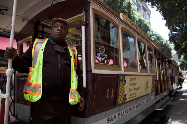 Trolley conductor Sam Eversley gazes up Powell Street. (Mark Andrew Boyer/KQED)