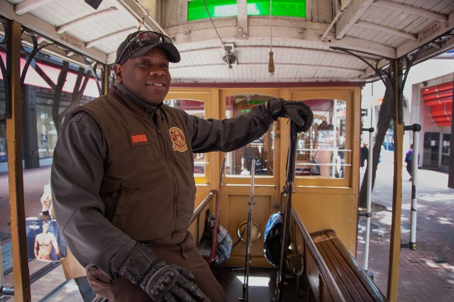 Cable car conductor Francis Givens, 51, of Brentwood, works on the Powell Street line. (Mark Andrew Boyer/KQED)