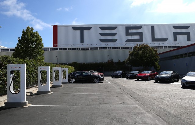 Vehicle charging stations at Tesla Motors plant in Fremont. (Justin Sullivan/Getty Images)
