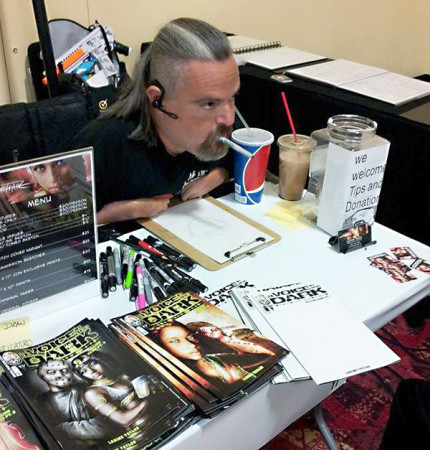 Larime Taylor signs his artwork for fans at Comic-Con in San Diego. (Courtesy Mark Walsh)