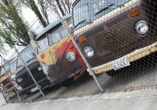 A wide variety of VW buses can be seen in the garage lot of Buslab. (Alejandro Rosas/KQED)