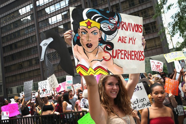 Protestors march at "slut walks" around the country to raise awareness around consent and sexual assault. (Scott Olson/Getty Images)
