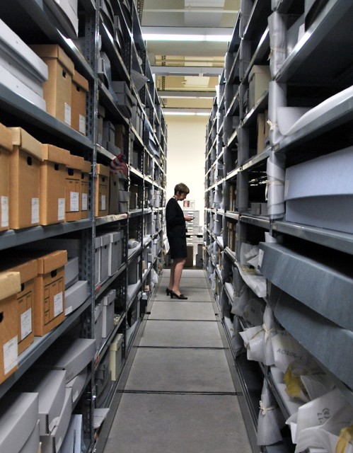 State archivist Nancy Lenoil looks through some of Governor Pete Wilson’s records. (Scott Detrow/KQED)
