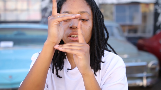 Jasmine Haynes, AKA TurferGirl, "finger tutting," a key element of Turfin', a hip-hop dance style that originated in Oakland. (Jeremy Raff/KQED)